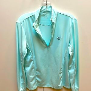 Vented sleeve long sleeve golf or tennis shirt.